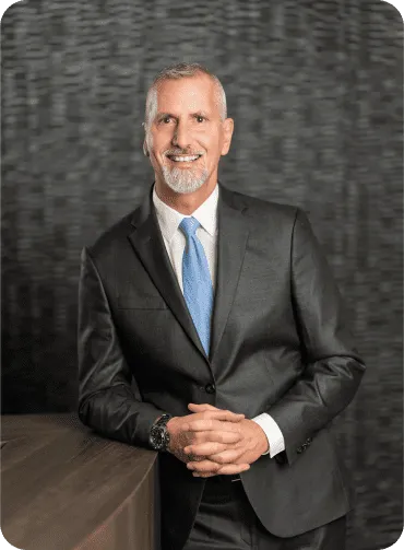 A large building with balconies and hanging potted plants