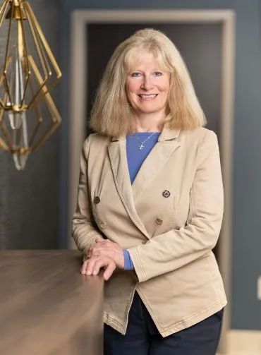 A large building with balconies and hanging potted plants