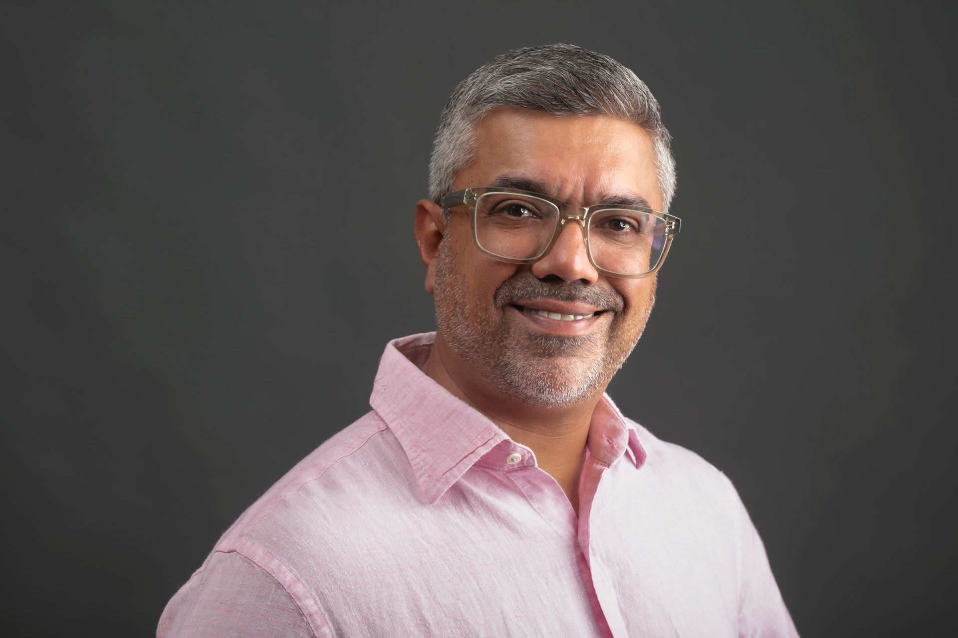 Umesh Chauha, founder of Marlin Human Capital smiling for the camera.