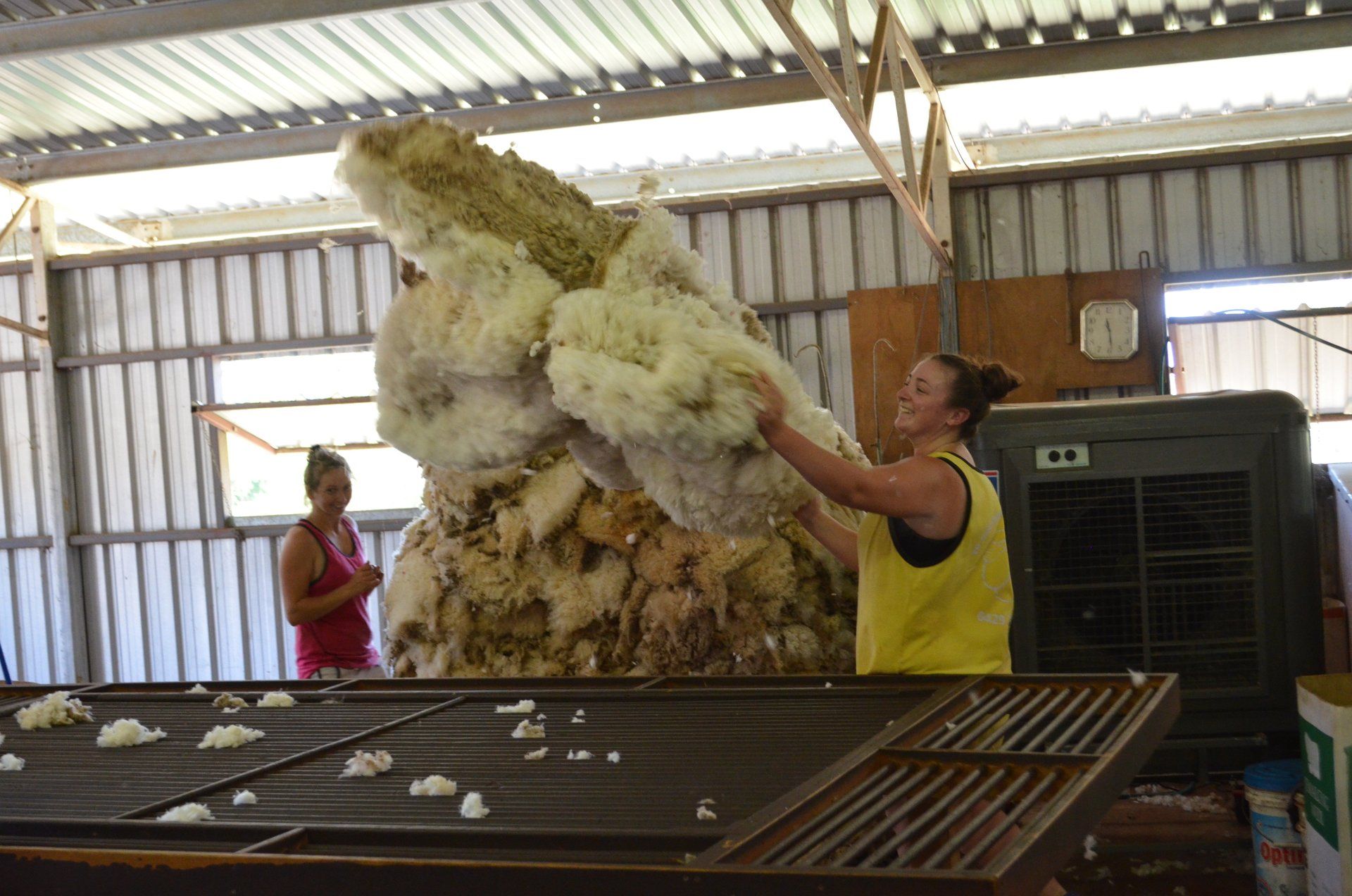 Smiling girls tossings fleece