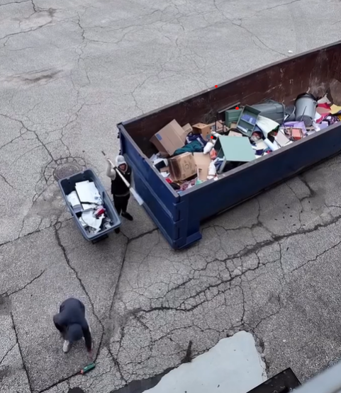 Three people near a dumpster: one sweeps, one pushes a cart, and one is by the dumpster.