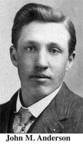 A black and white photo of john m. anderson in a suit and tie