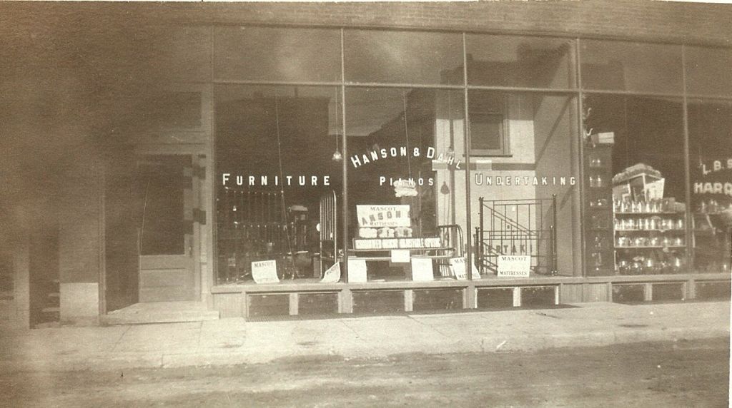 A black and white photo of a furniture store