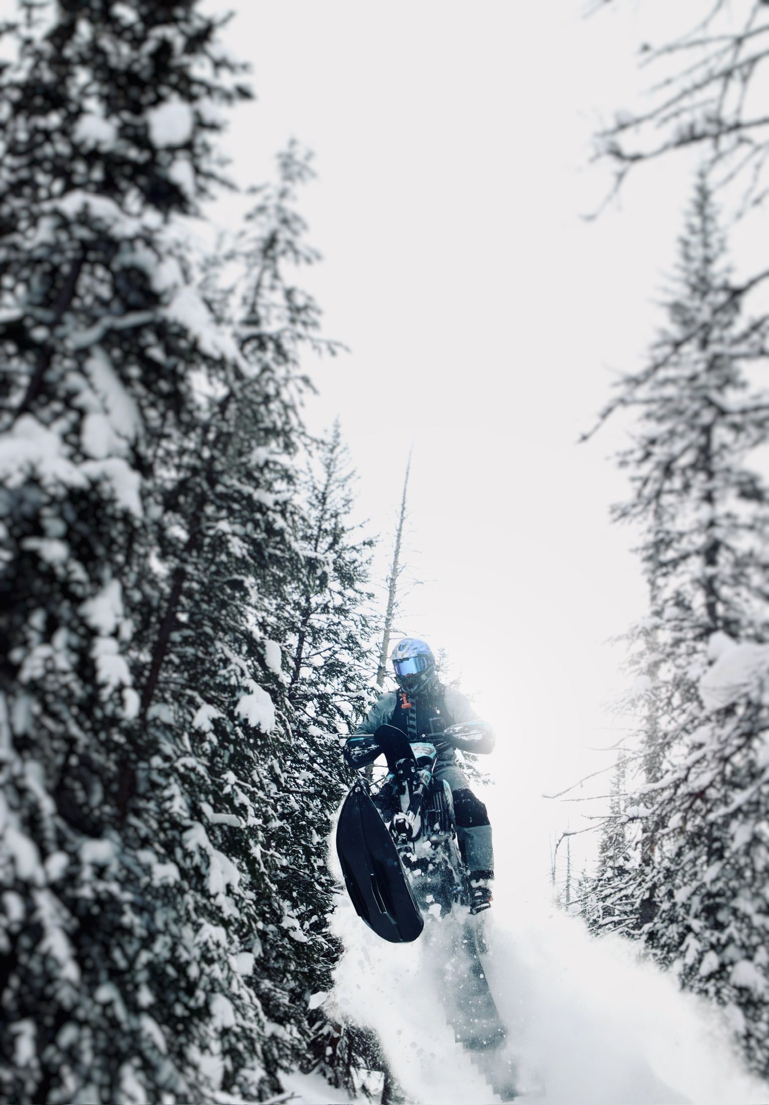 Rider snowbiking deep powder near Teton Valley