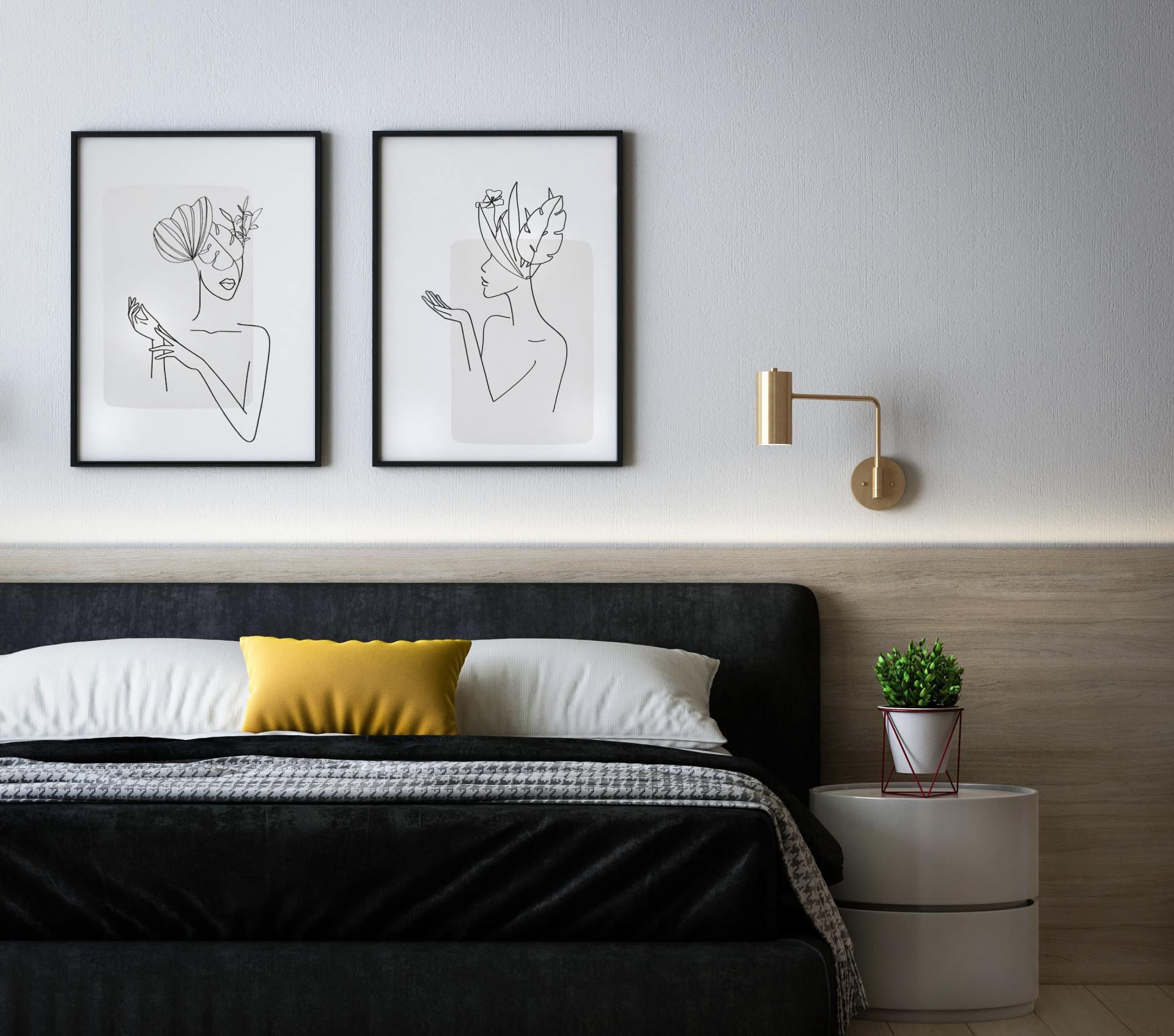 black and white classic bedroom with double bed and 2 pictures above the headboard