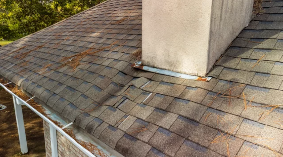 There is a chimney on the roof of a house in rockwall texas