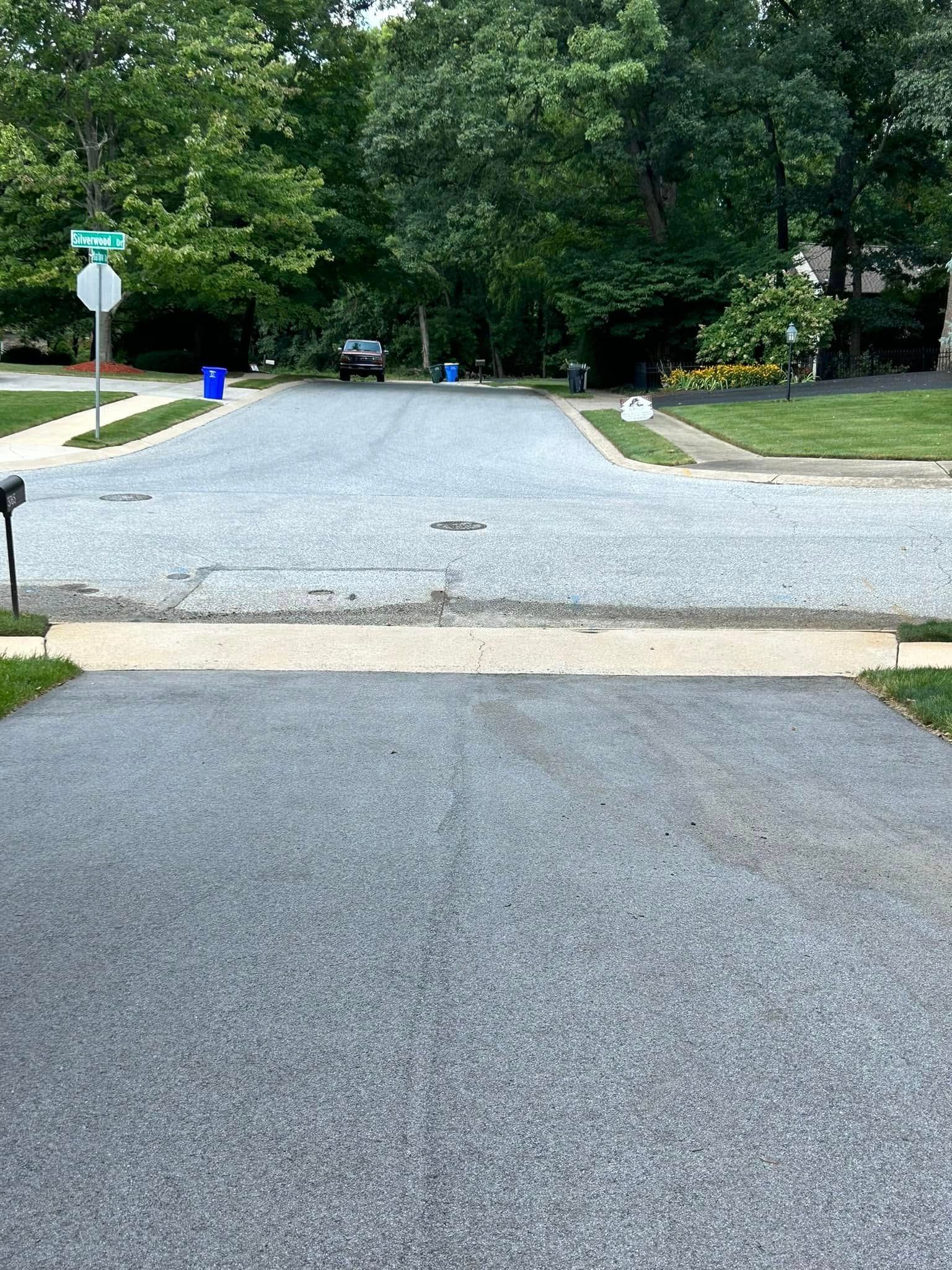 There is a mailbox on the side of the road.