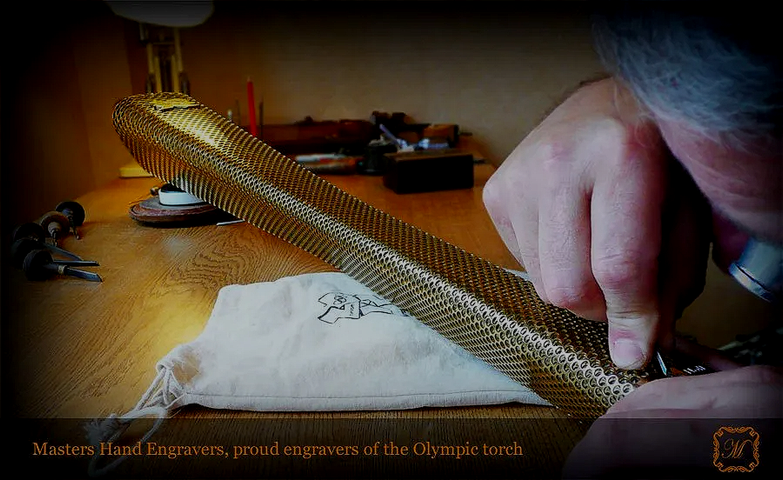 Hand engraving the Olympic Torch