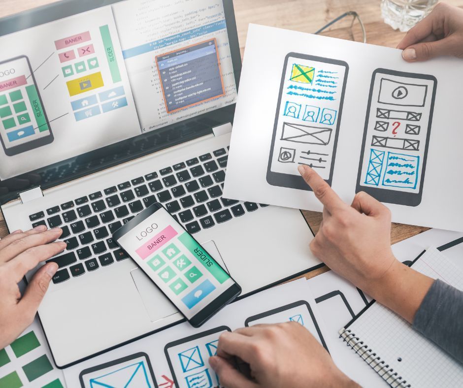 Computer screen displaying a website design, with various layout mockups and images.