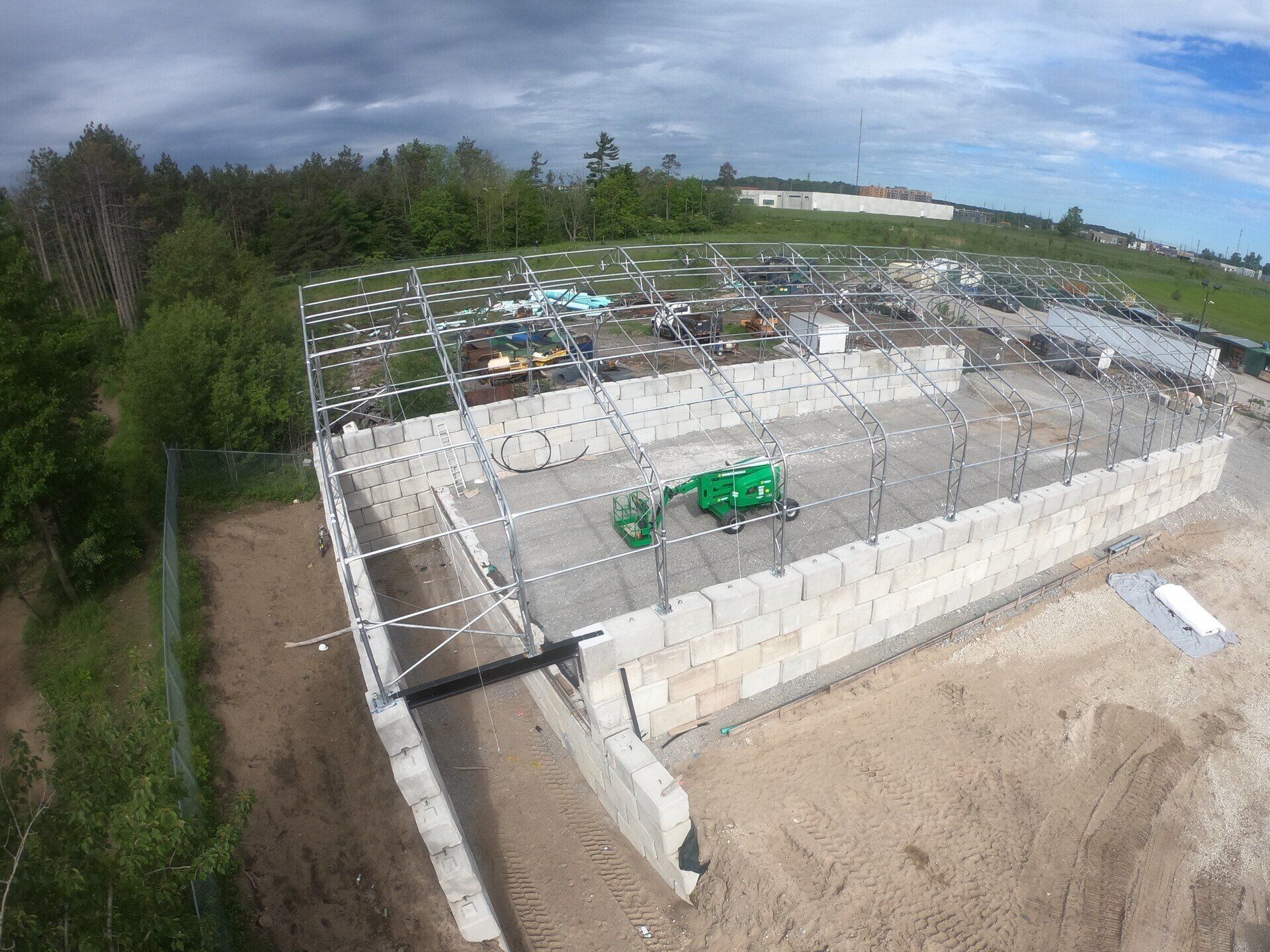 An aerial view of a large building under construction.