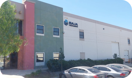Exterior of a Baja Fresh restaurant building with parked cars in front
