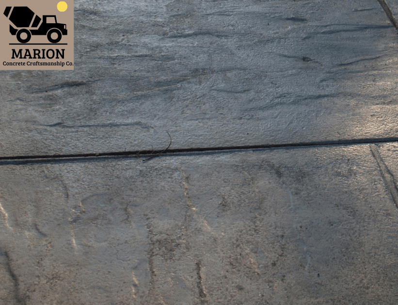An image of a broken and muddy driveway to be repaired.