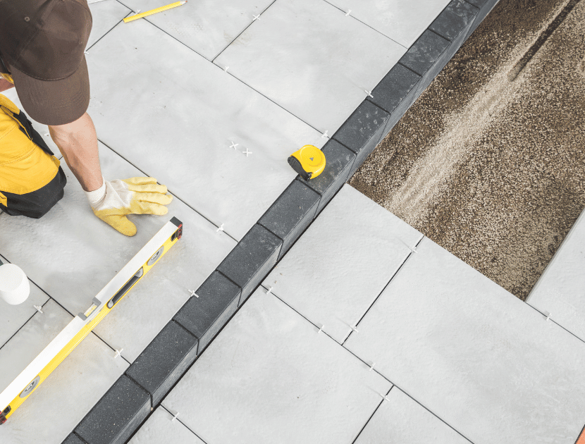 An image of a broken and muddy driveway to be repaired.
