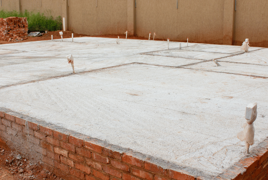 An image of a broken and muddy driveway to be repaired.