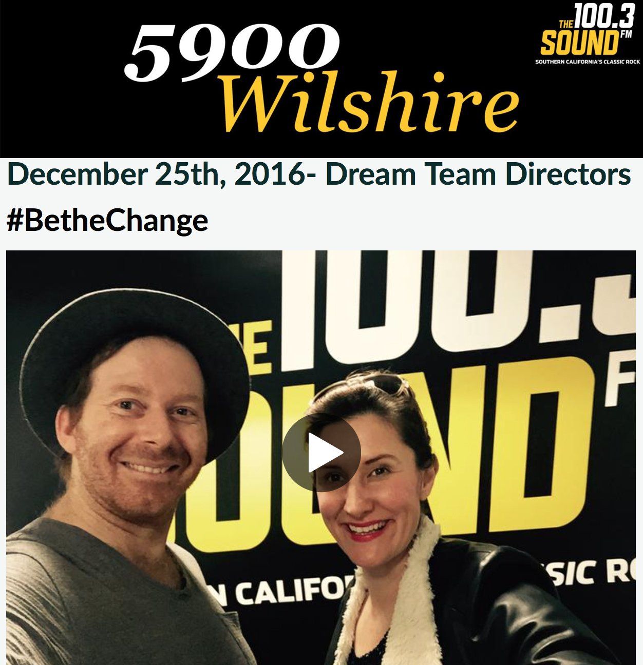 A man and a woman are standing in front of a sign that says 5900 wilshire