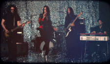 A group of people are playing instruments on a stage.