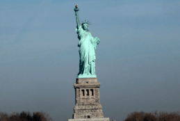 The statue of liberty in new york city on a cloudy day