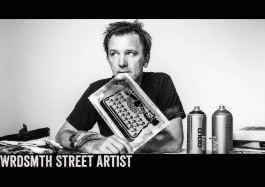 A black and white photo of wrdsmith street artist