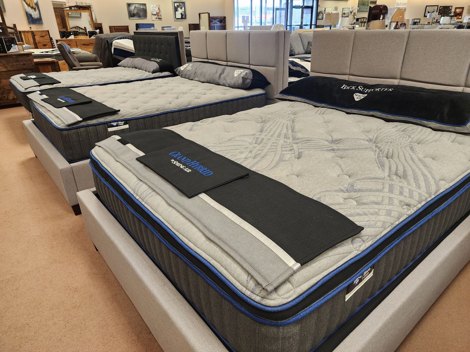 A mattress is sitting on top of a bed in a store.