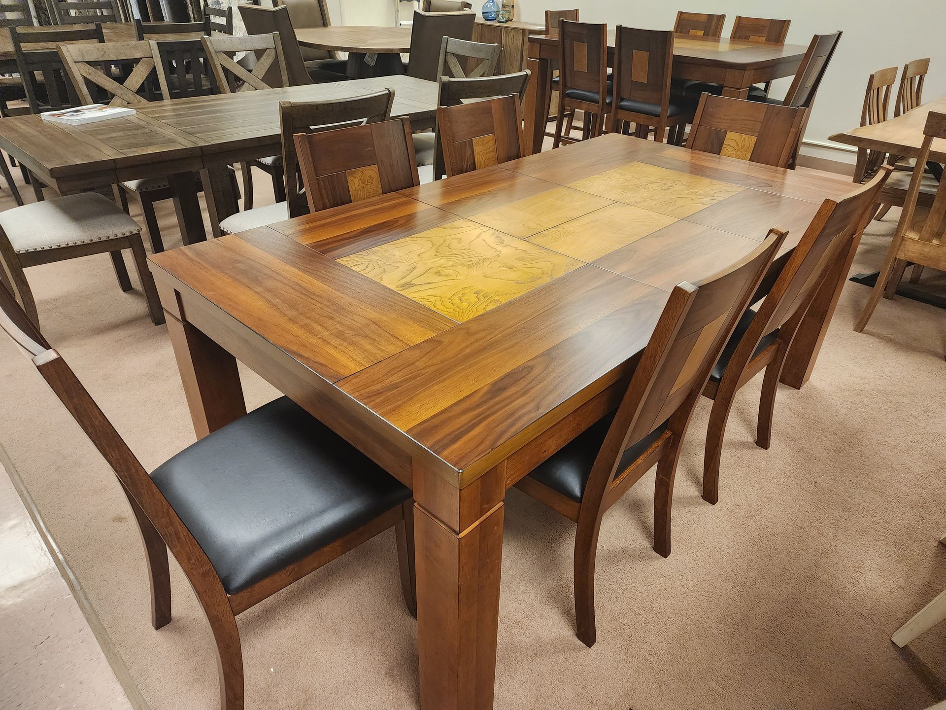 A wooden table and chairs in a room
