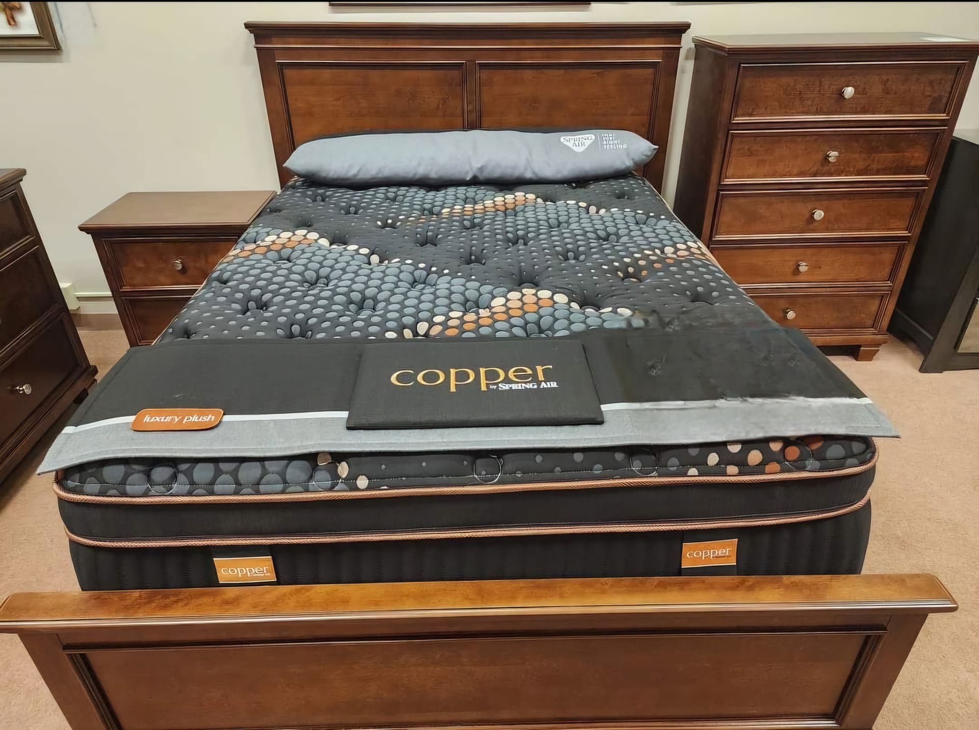 A bed with a mattress that says coppol on it