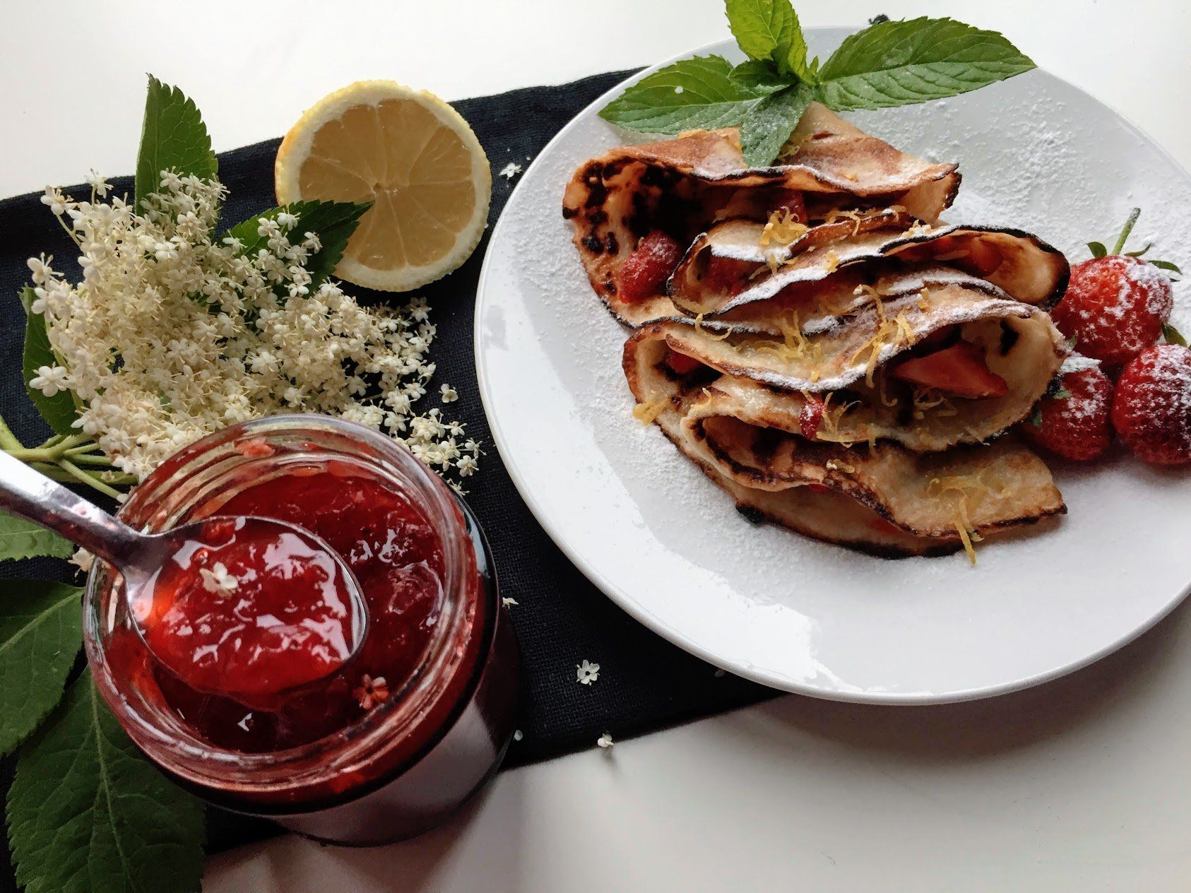 Eggless crepes filled with homemade strawberry and elderflower jam