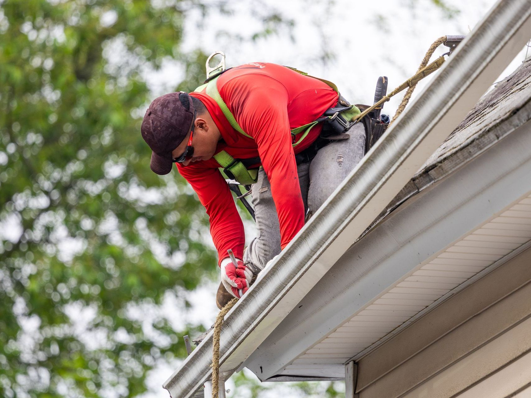 A roofer repairing a roof