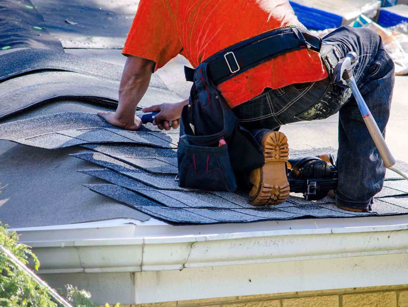 A roofer repairing a roof