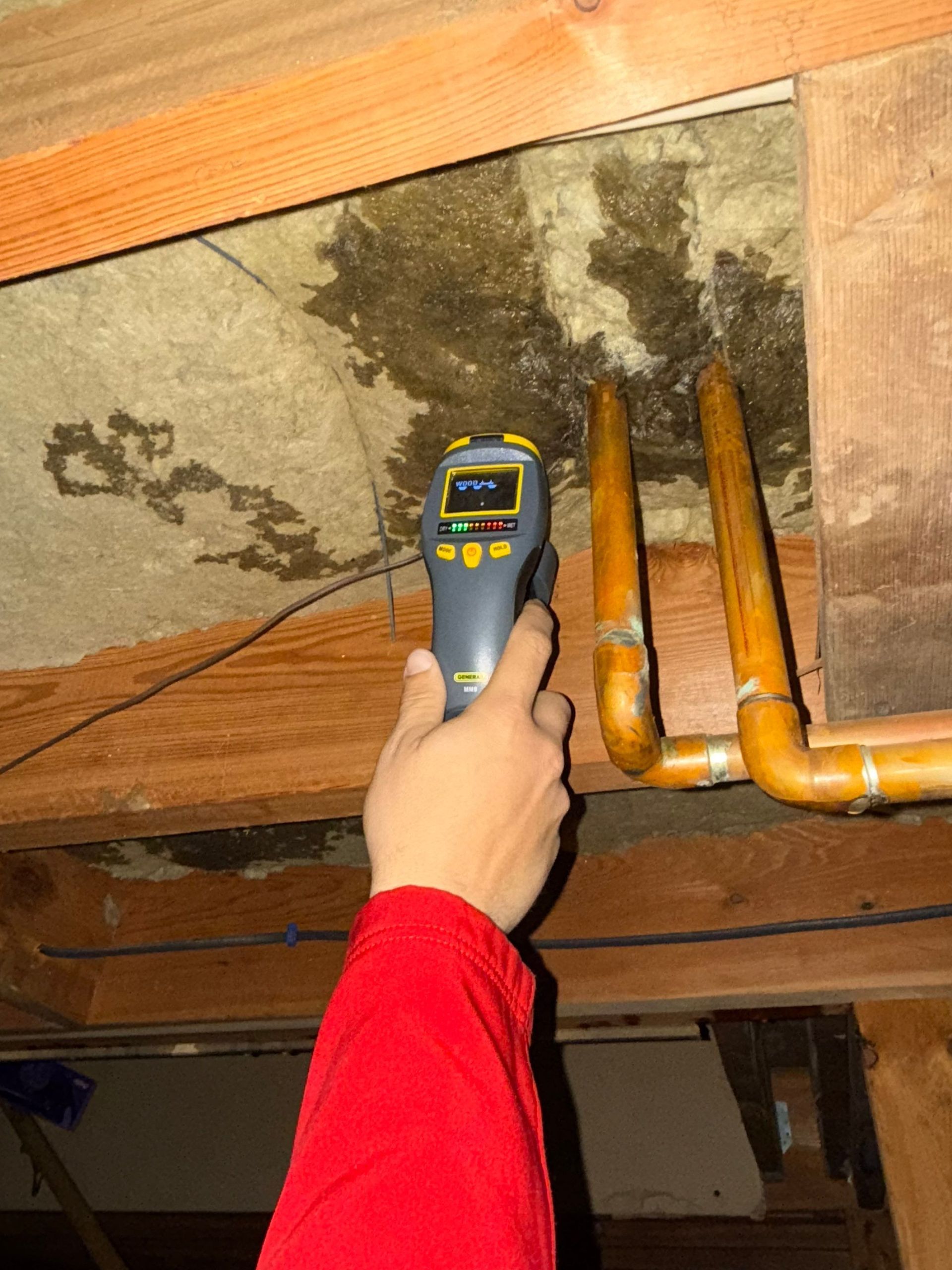 The Manny Roofing team working to restore a room damaged by a serious roof leak.