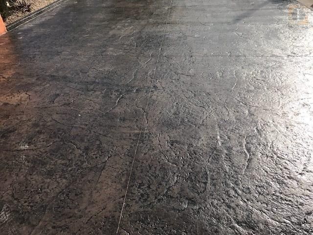 A close up of a concrete floor with a swirl pattern.