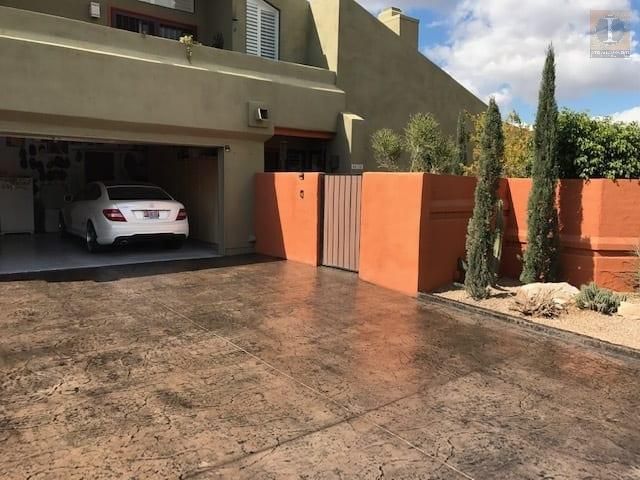 A white car is parked in the garage of a house