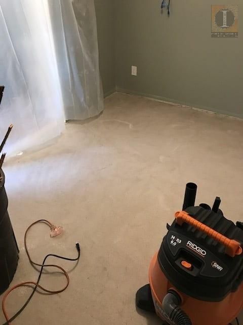 A room with a vacuum cleaner that says ridgid on it