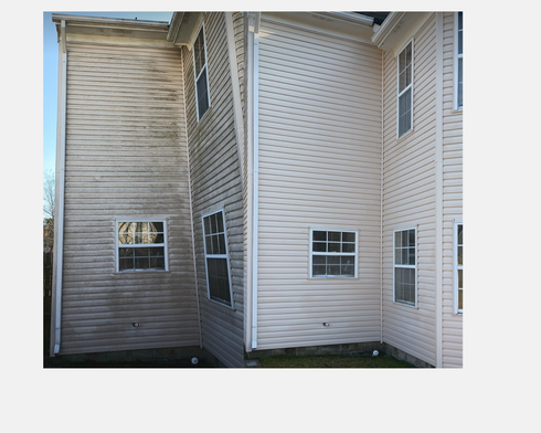 Side-by-side comparison of house siding; left side dirty, right side clean, after power washing / soft washing.