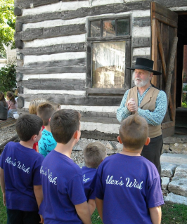 Students learn about the Society’s 1835 Log Cabin in the Pioneer education program.