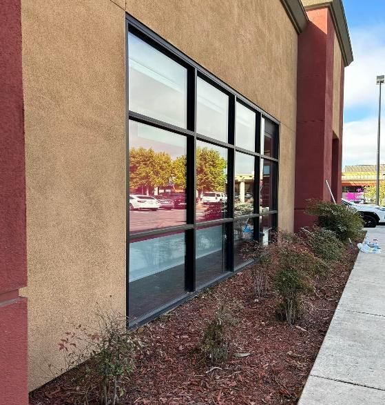 Exterior view of a building with a large window.