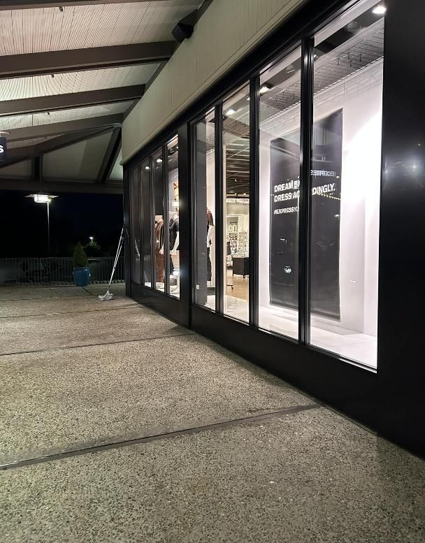 Exterior view of a store with large glass windows.