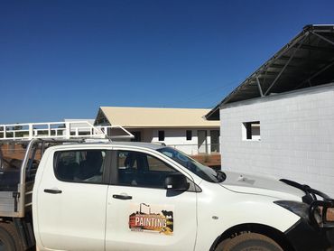 A White Truck Is Parked in Front of A Building — North West Queensland Painting in The Gap, QLD