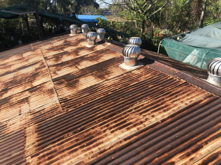 A Rusty Roof with A Lot of Vents on It — North West Queensland Painting in The Gap, QLD