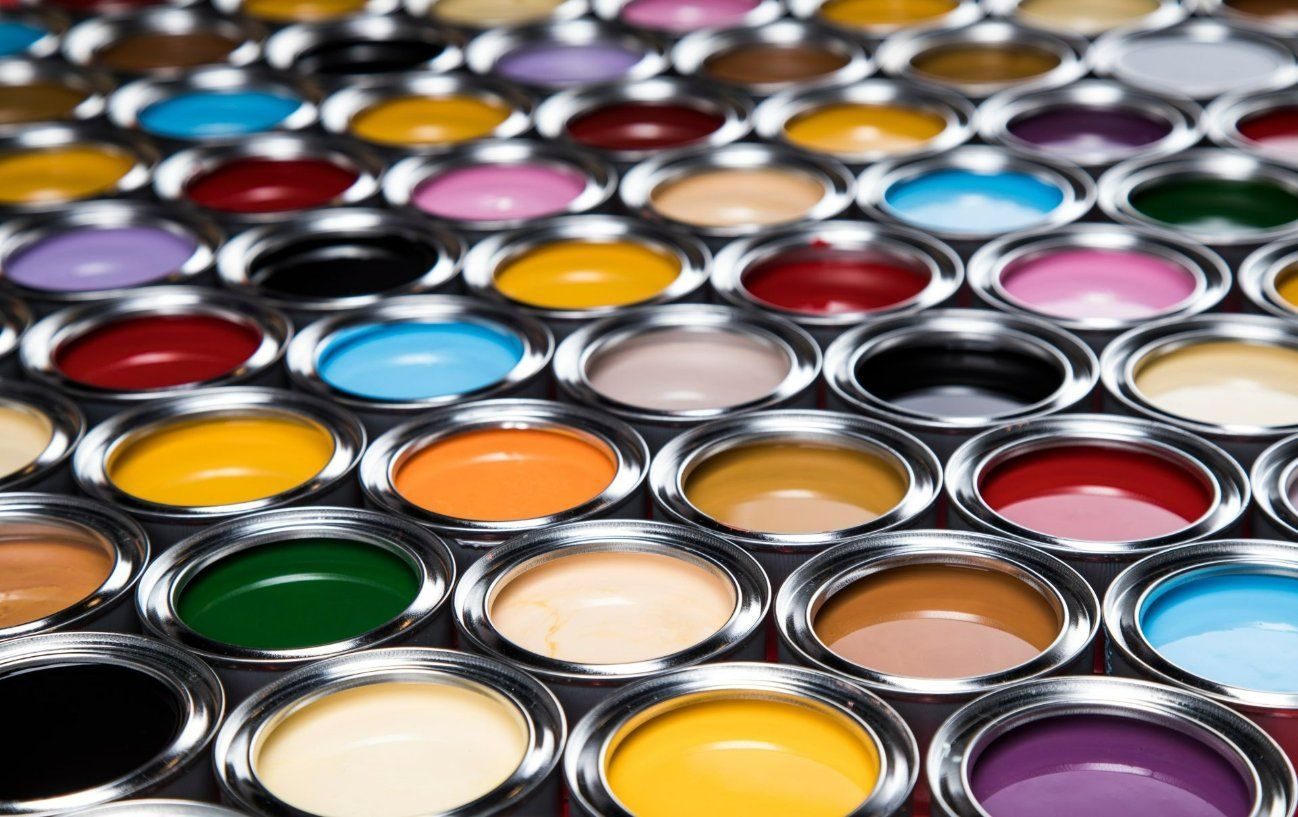 A Bunch of Cans of Paint of Different Colors Are Lined up On a Table — North West Queensland Painting in The Gap, QLD