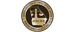 The logo for the georgia association of criminal defense lawyers.