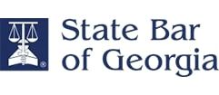 The state bar of georgia logo has a scale of justice on it.