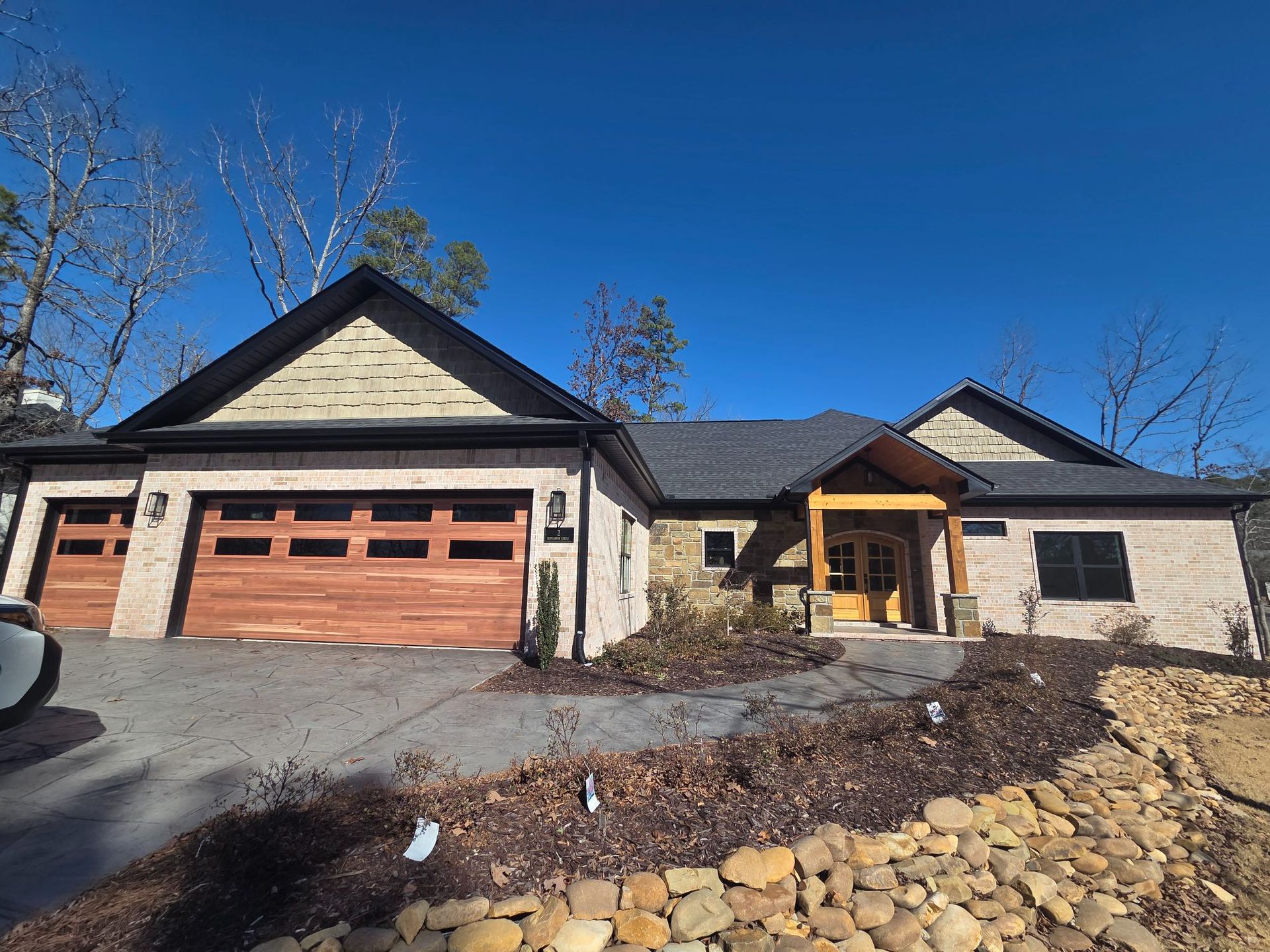 A construction worker is holding a clipboard and writing on it.