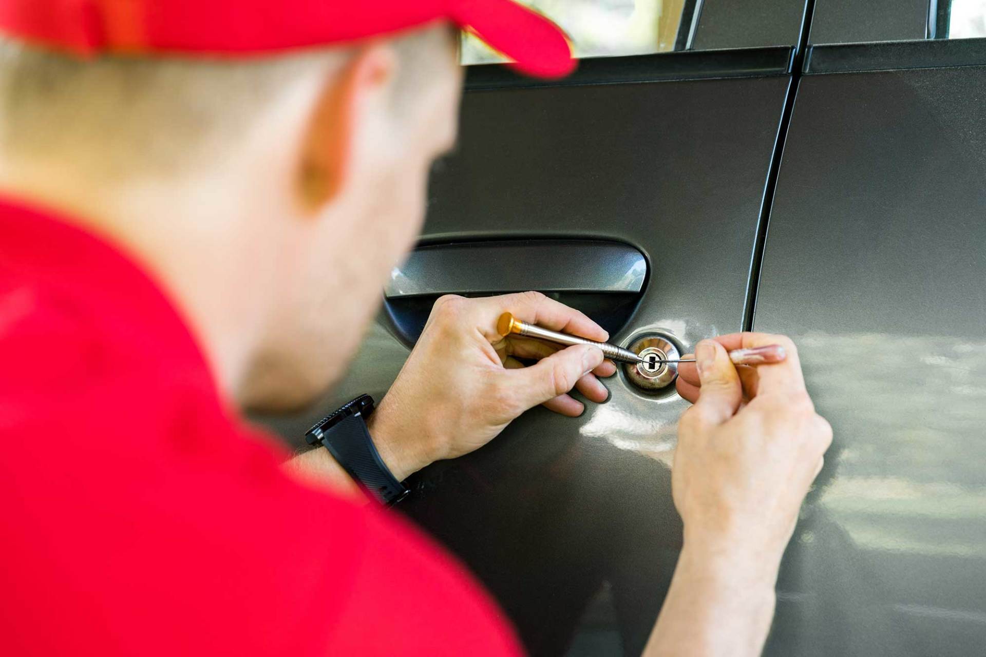 Locksmith Opening Car Door with Lockpicker — Hammond, IN — Columbia Lock & Key