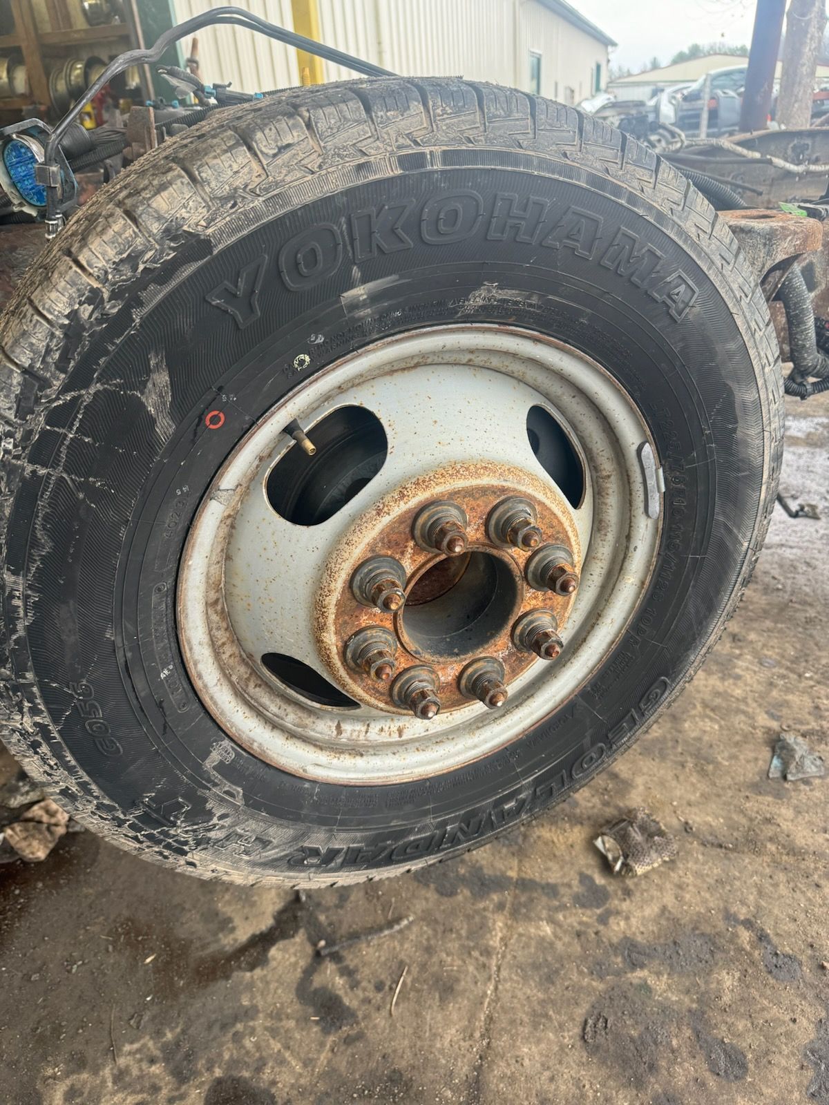 A close up of a tire and rim on a truck.