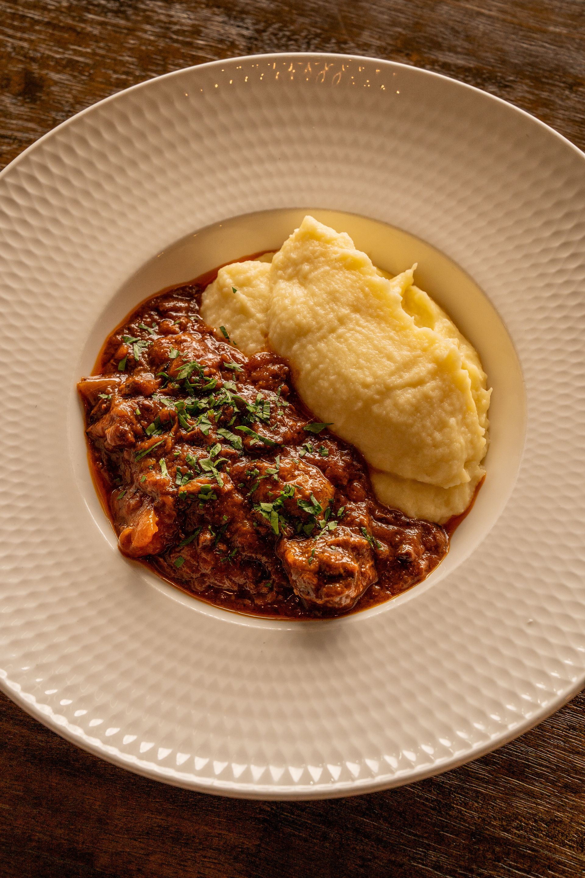 Braised Wagyu beef cheek in red wine and herbs - Served with Pommes Purée - $14 Add On.