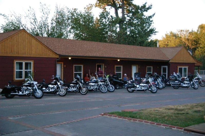 A row of motorcycles parked in front of a building