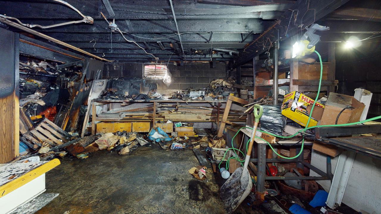 A very messy room with a lot of junk in it.