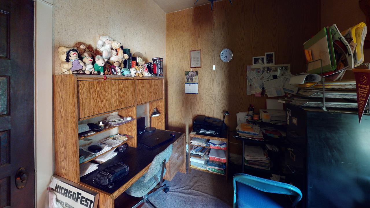 A room with a desk and a sign that says breakfast