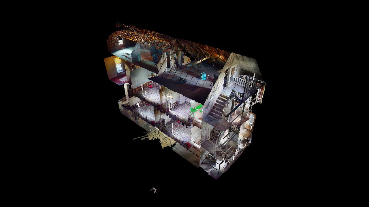 An aerial view of a building at night.
