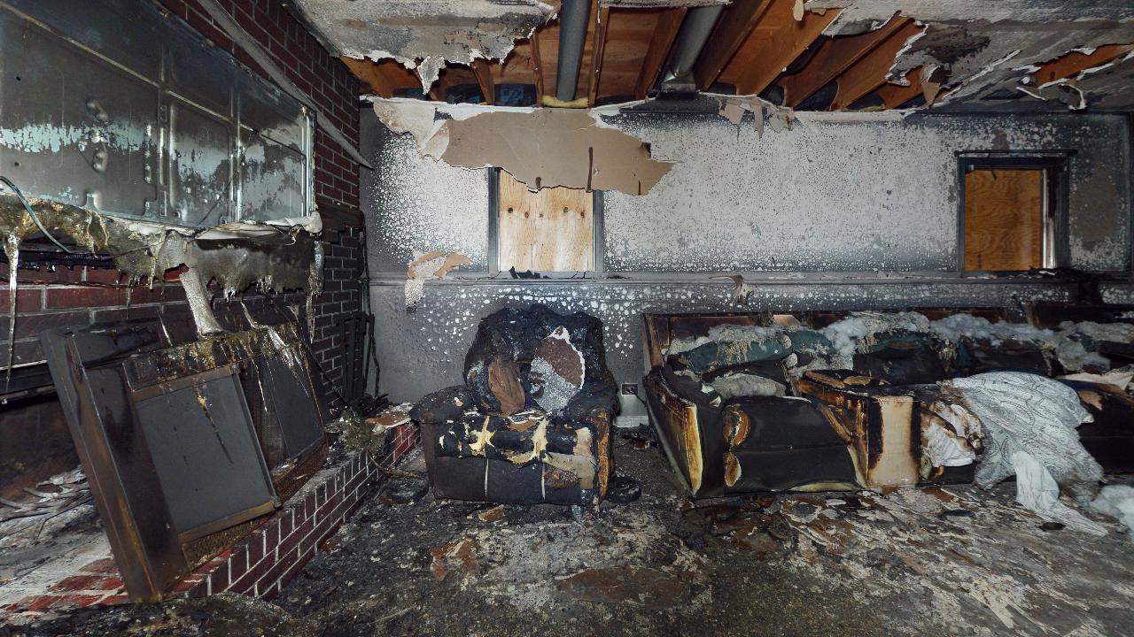 A room in a house that has been damaged by a fire.